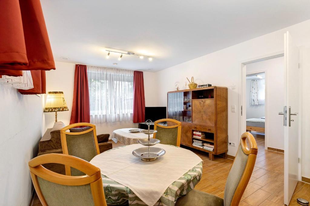 a living room with a table and a dining room at Julia's Ferienwohnung in Gallin
