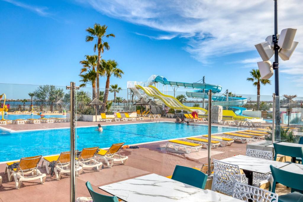 a pool at a resort with a water park at Le 370 Lattes in Lattes