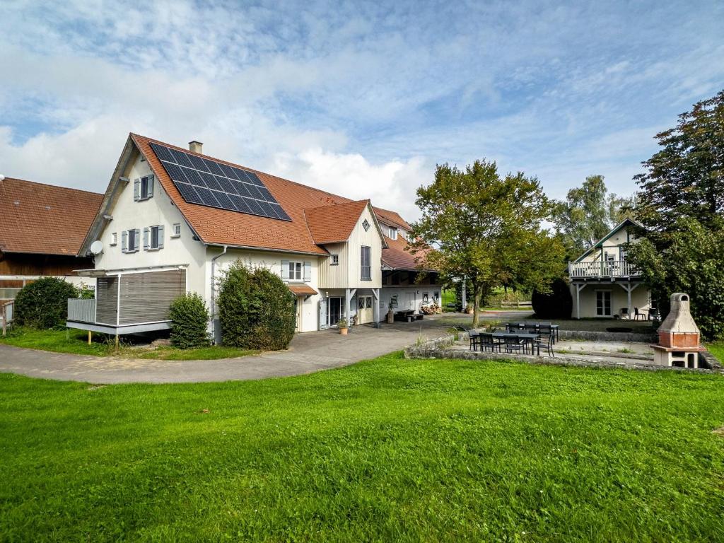 a house with solar panels on the roof at Schnyder Ranch in Ravensburg
