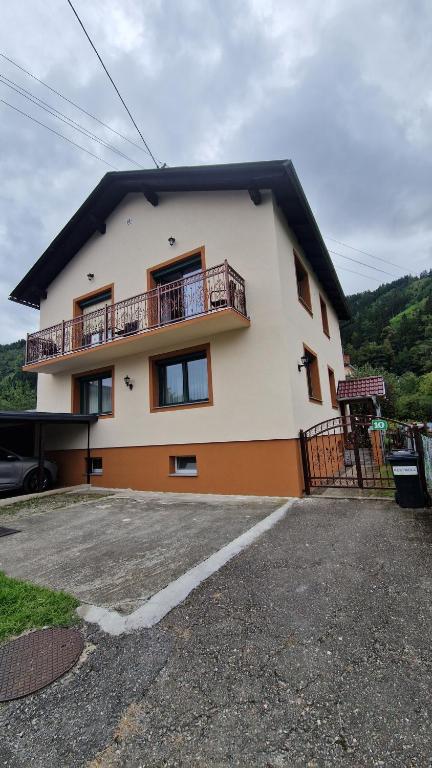 a house with a balcony on the side of it at Haus Rose in Kaisersberg