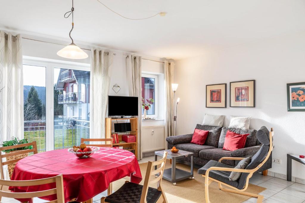 a living room with a couch and a table at Ferienwohnung Tannenblick 1-1 in Oberhof