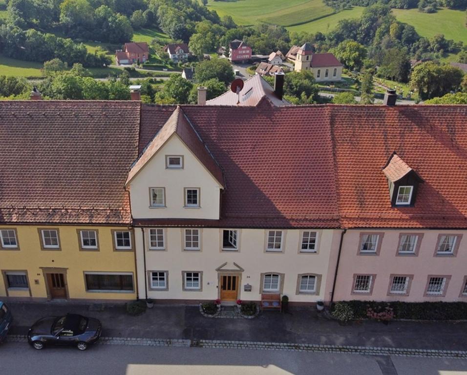 an overhead view of a building with red roofs at Ferienwohnung im Hofratshaus in Schrozberg