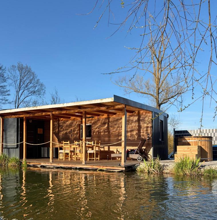 a house on the water next to a river at Tiny house Františka in Klatovy