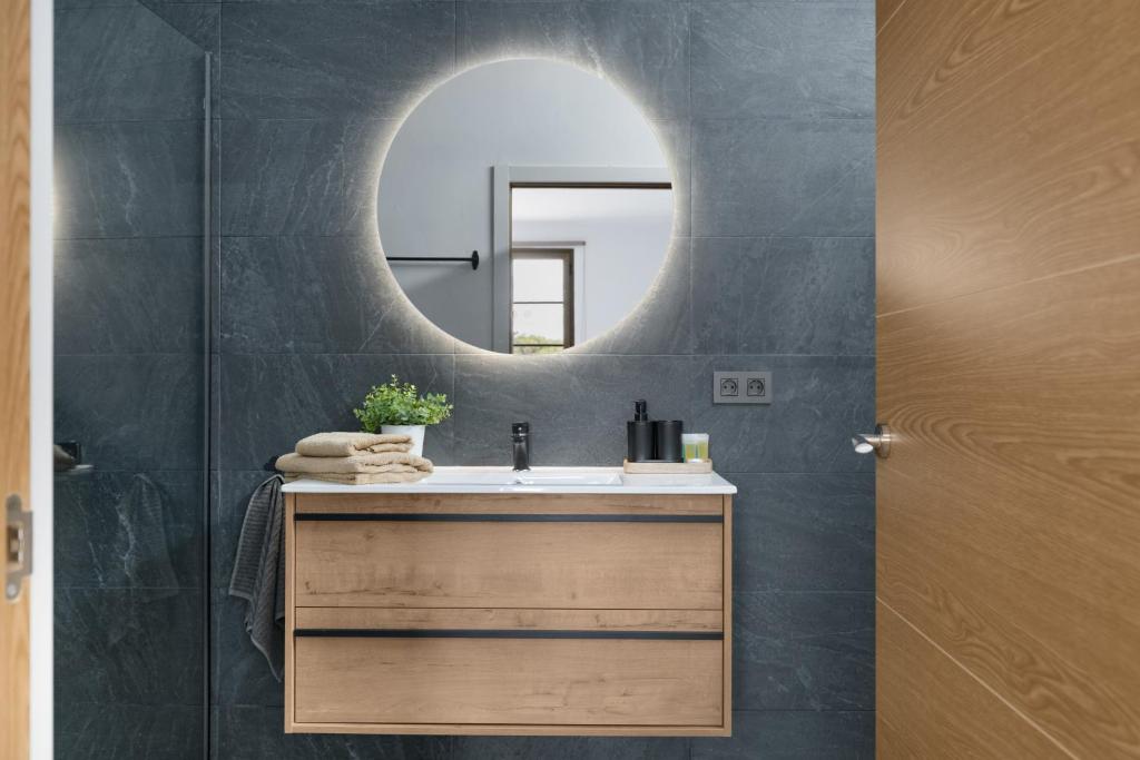 a bathroom with a sink and a mirror at Casita Lanzarote in Teguise