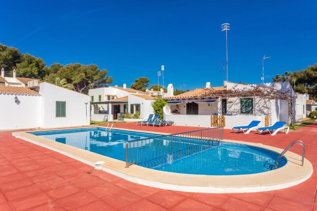 a swimming pool in the middle of a house at Son Xoriguer 6 in Son Xoriguer