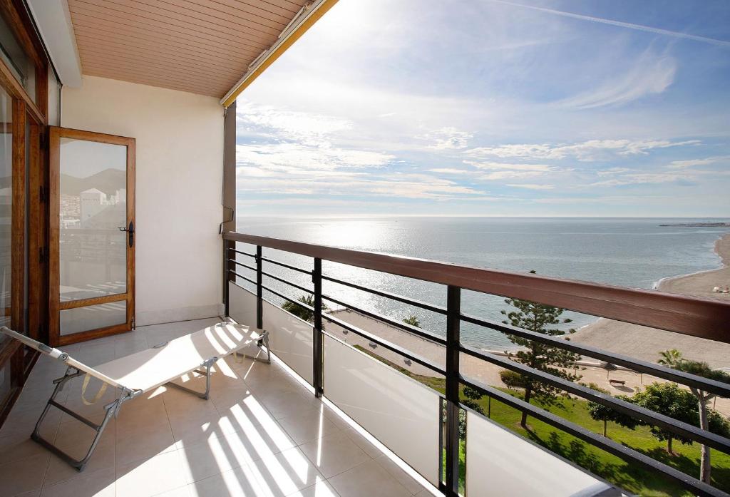 a balcony with a view of the ocean at Primera linea vistas panoramicas in Torremolinos