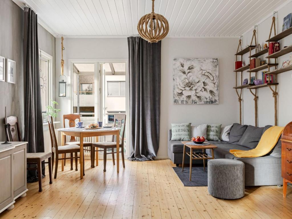 a living room with a couch and a table at Apartment Alegränd by Interhome in Falkenberg