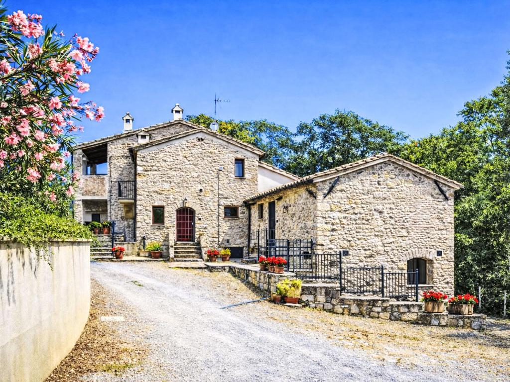an old stone house on a dirt road at Apartment Ginestra by Interhome in Perugia