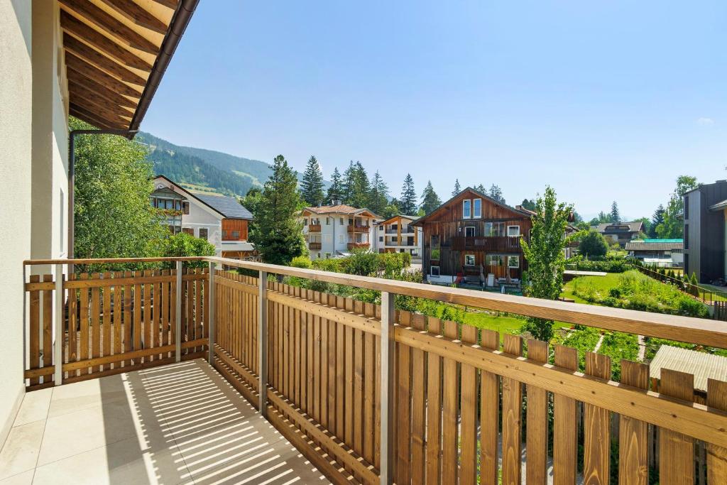 a balcony with a view of a town at Premium App Hofer Elisabeth in Villabassa