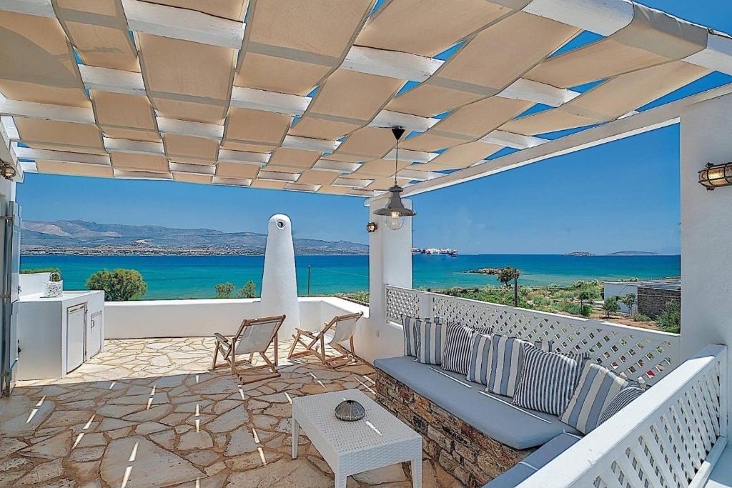 a patio with a view of the ocean at Villa Afroditi A in Antiparos