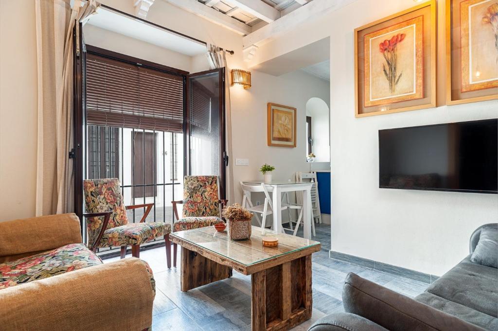 a living room with a couch and a table at Rosa in Vejer de la Frontera