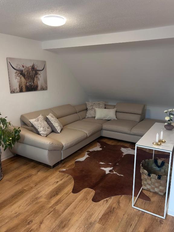 a living room with a couch and a table at Modern Apartment in Bebra