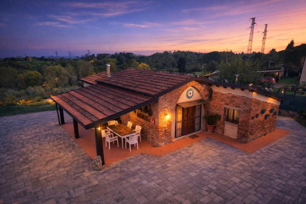 an overhead view of a house with a roof at Il Casale di Lucullo-Holiday Home with Pool and Spa- in Lucignano