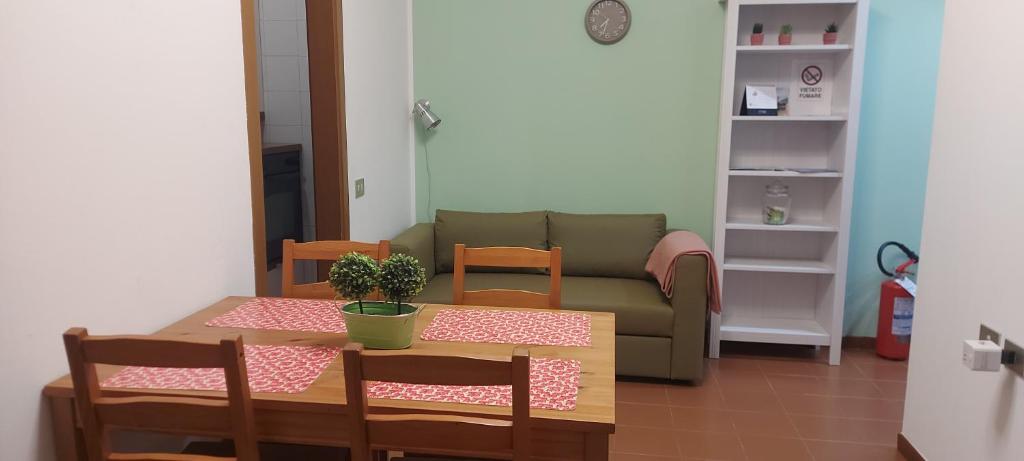 a living room with a table and a couch at Dany's house in Lecco