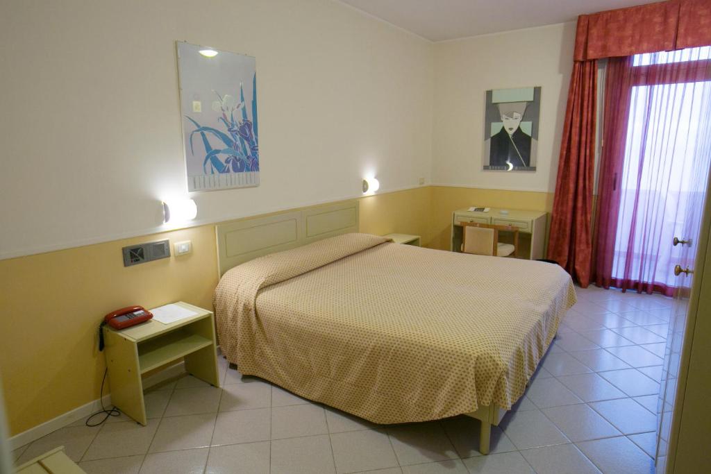 Postel nebo postele na pokoji v ubytování Hotel Salsello