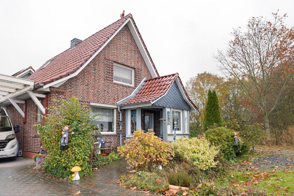 a brown brick house with a roof at Ferienhaus Marchlewski in Brunsbüttel