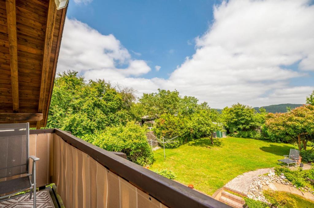 a balcony with a view of a yard at Haus Emanuel in Weilerbach