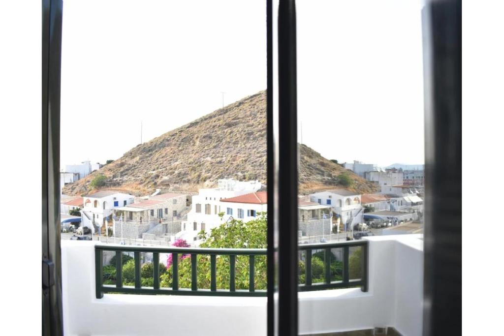 a view of a city from a window at Manolika Studio 5 in Kithnos