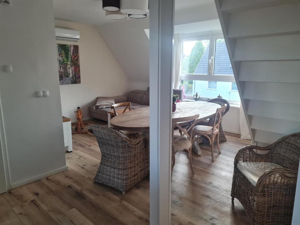 a dining room with a table and chairs at Maisonette-Wohnung in Gladbeck in Gladbeck