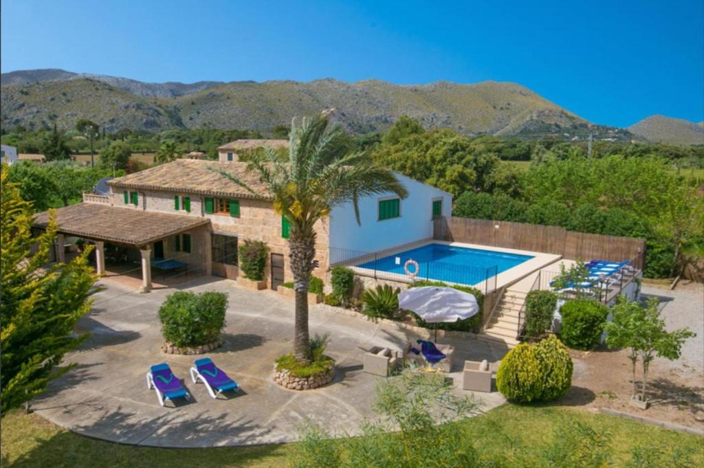 an aerial view of a house with a swimming pool at Can Pou Petit in Pollença
