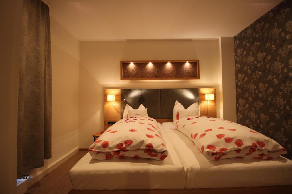 Postel nebo postele na pokoji v ubytování Hotel Hartl's Lindenmühle