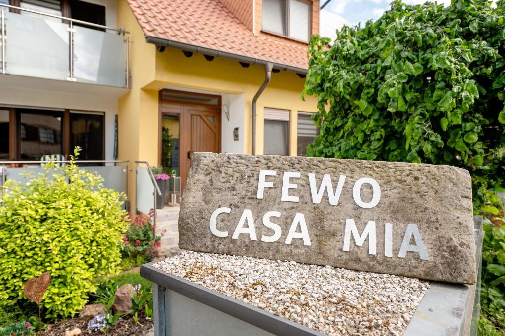 a stone bench in front of a house at Casa Mia 2 in Bad Dürkheim