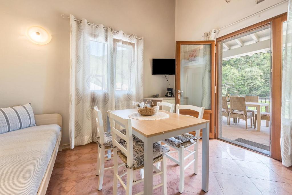a living room with a table and a couch at Residence Tatiana B3 in Tremosine Sul Garda