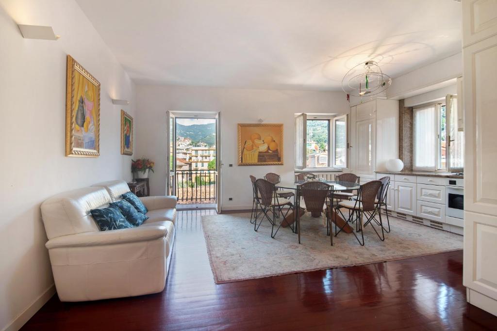 a living room with a couch and a table at Appartamento Gabbiano in Rapallo