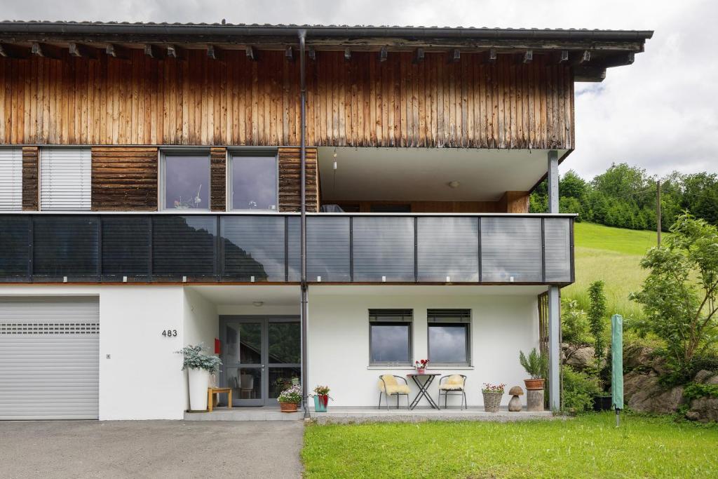 an external view of a house with a wooden roof at Wiff's Studio in Mellau