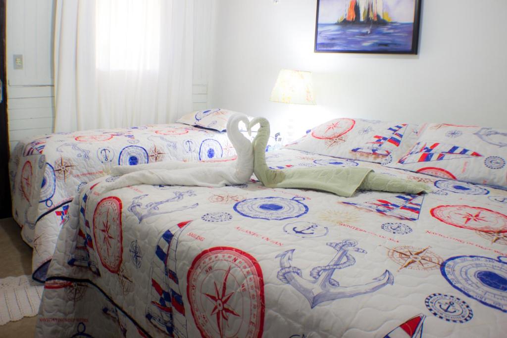 Cama ou camas em um quarto em Pousada Canto da Galheta