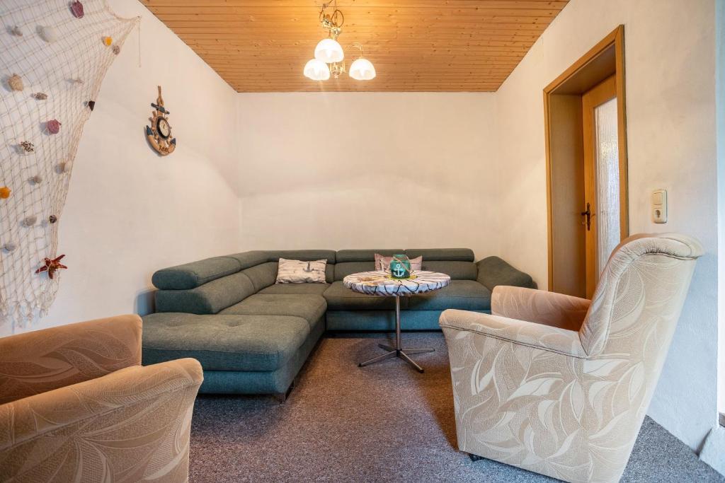 a living room with a couch and a table at Ferienwohnung Wilhelm in Züssow