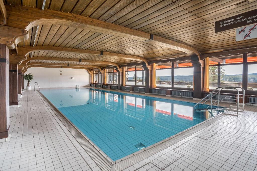 an indoor swimming pool with a large swimming pool at Terrassenpark Apartment 160 in Schonach