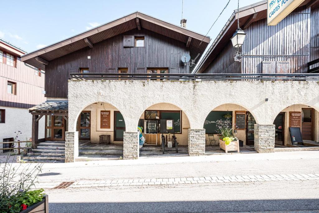 a large building with arches in front of it at L'esterelle in La Plagne Tarentaise