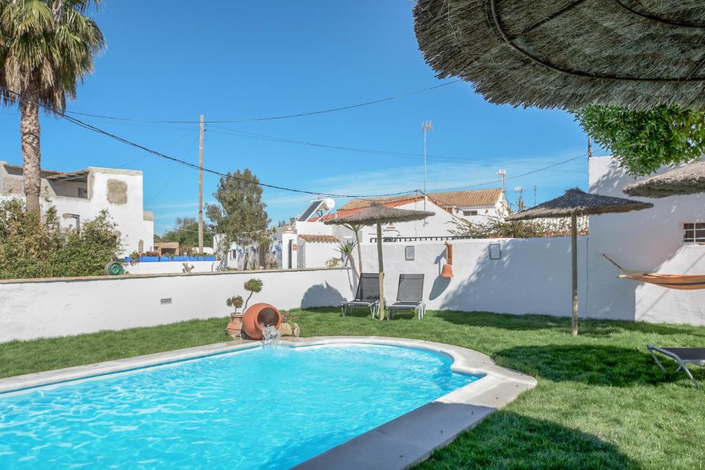 a swimming pool in the backyard of a house at Casa Nesenka 1 in Zahora