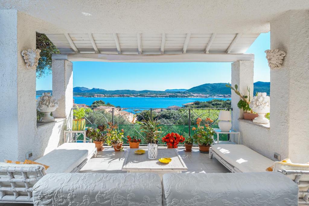 a balcony with a view of the water at Bella Vista Marinella 1 in Olbia