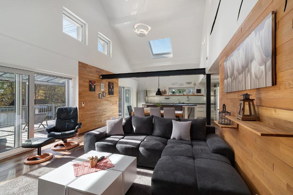 a living room with a couch and a table at Forest Apartment - Renchen in Renchen