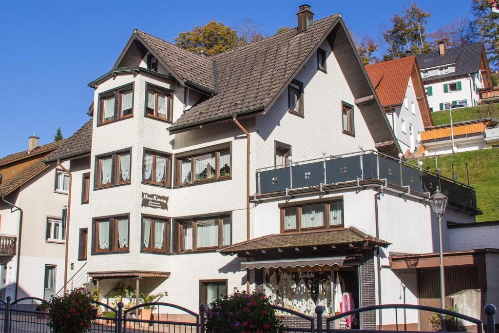 a large white house with a black roof at Heidi Kimmig in Bad Griesbach