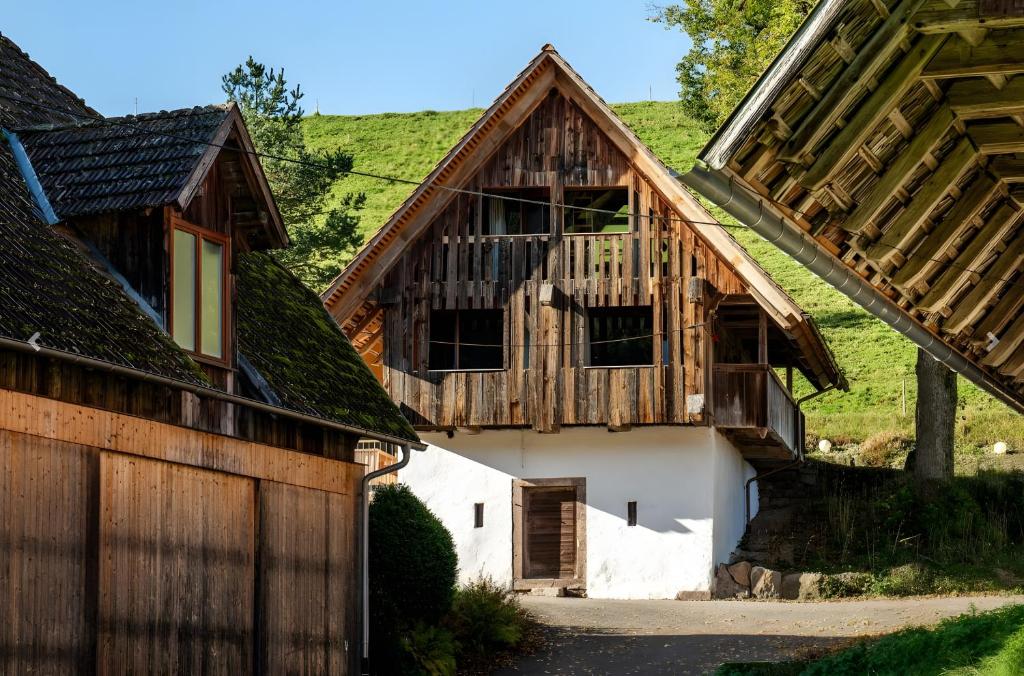 a couple of houses with wooden roofs at Ferienhaus Kornspeicher in Hornberg