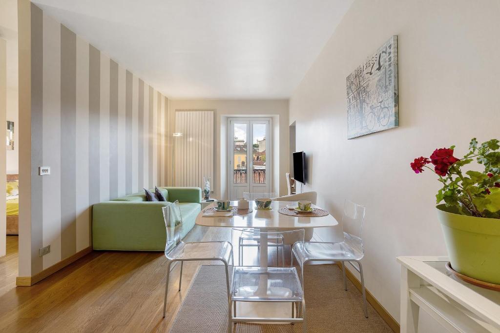 a living room with a table and chairs at Crocetta10 in Milan