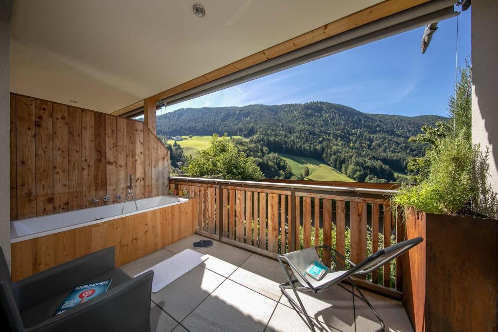 a balcony with a view of the mountains at Sonnleiten Sonnenadler 1 in Collepietra
