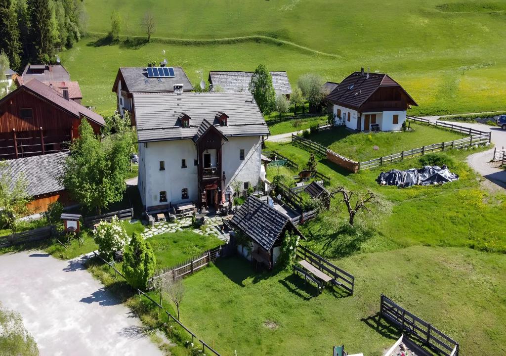 an aerial view of a house and a barn at Plazores in San Vigilio Di Marebbe
