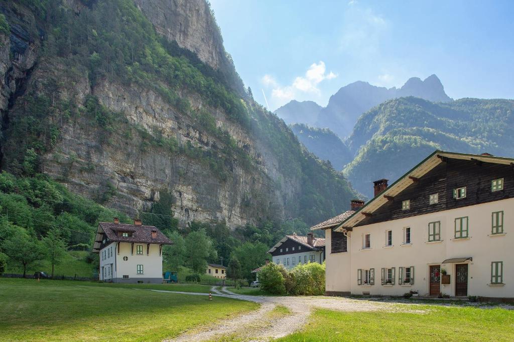 a group of houses in front of a mountain at Villa Stanga in Sedico