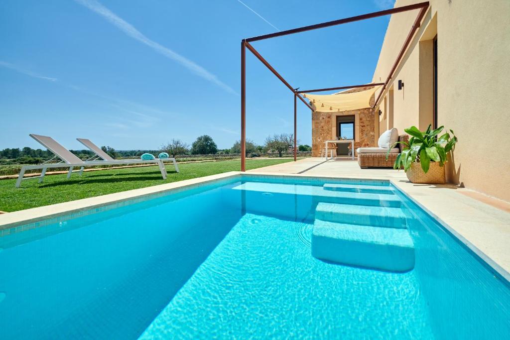 a swimming pool in the backyard of a house at Son Rossinyol Nou - Ses Figueretes in Islas Baleares