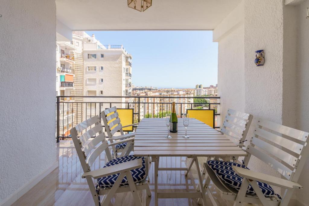 a table and chairs on a balcony with a view at Apartment Acapulco 6 in Fuengirola