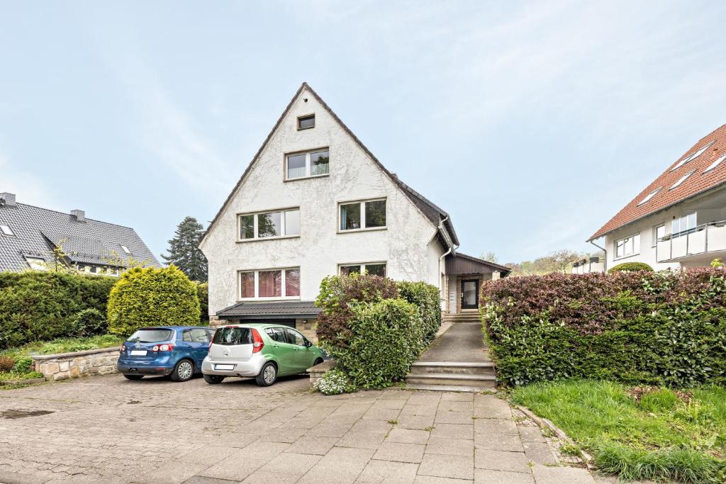 a house with two cars parked in front of it at Bad day good day in Horn-Bad Meinberg