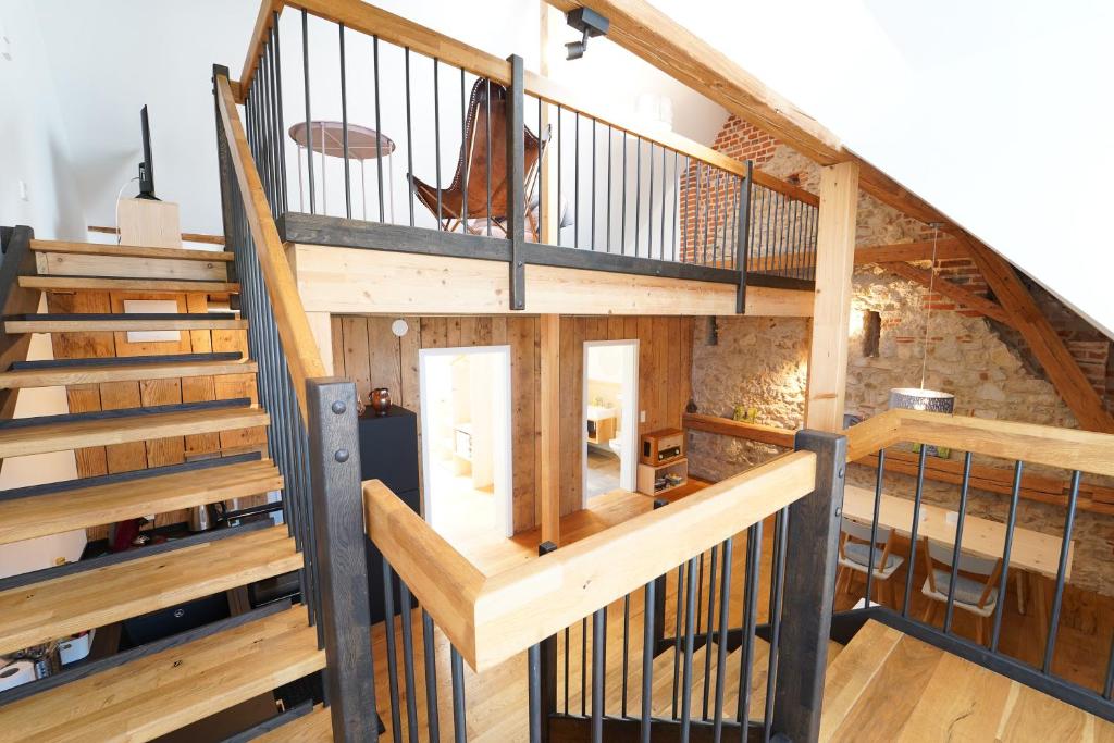 an overhead view of a loft with wooden stairs at Wendlingen Ferienwohnung 3 in Freiburg im Breisgau