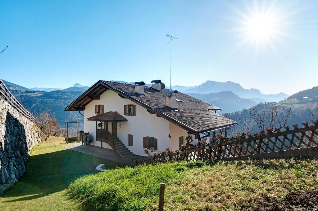a house on the side of a hill at Malsethhof in Villandro