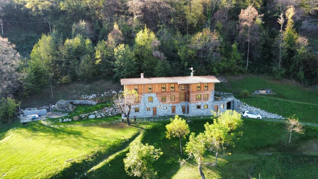 an aerial view of a large house in a field at Bellagio - Baita treeb Tramontana in Bellagio