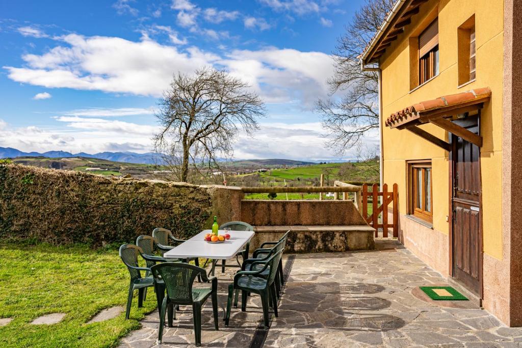 a table and chairs on a patio with a view at Casa Nueva in Salas