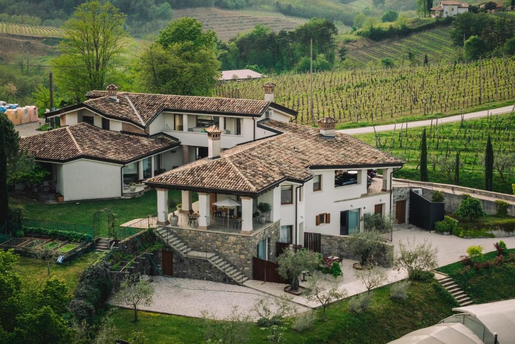 an aerial view of a house in a vineyard at Maravida Vacation Rooms in Dobrovo